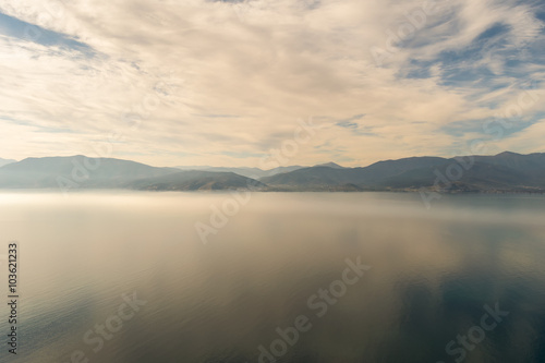Dramatic landscape of the mountains  the sea and the fog at Nafplio in Greece. View from Palamidi castle.  