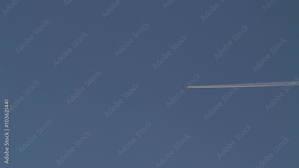A high altitude jet airliner leaving contrails A high altitude jet airliner leaving contrails