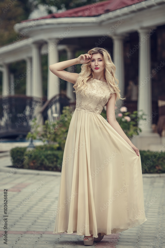 fashion outdoor photo of elegant beautiful woman with blond hair