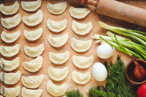 Vareniki (dumplings), pierogi before boiling - traditional Ukrainian food
