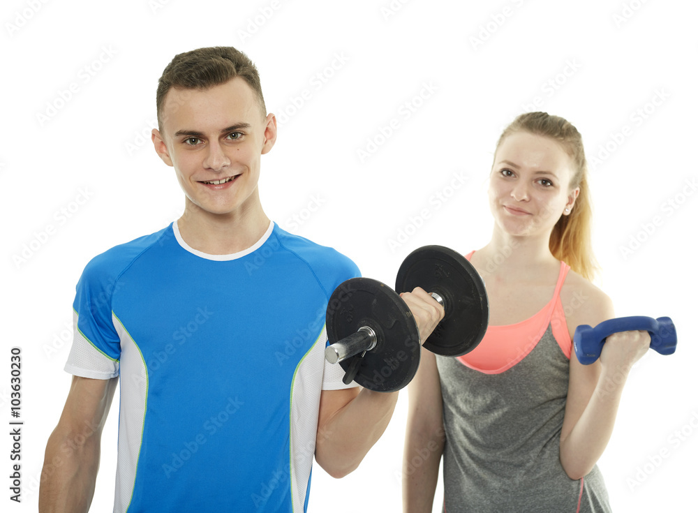 Teenagers working out with dumbbells Teenagers working out with dumbbells