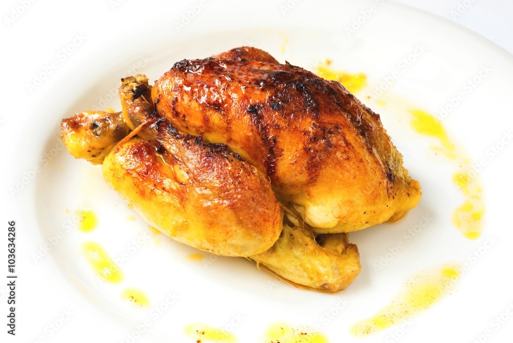 Whole grilled chicken on white background Whole grilled chicken on white background