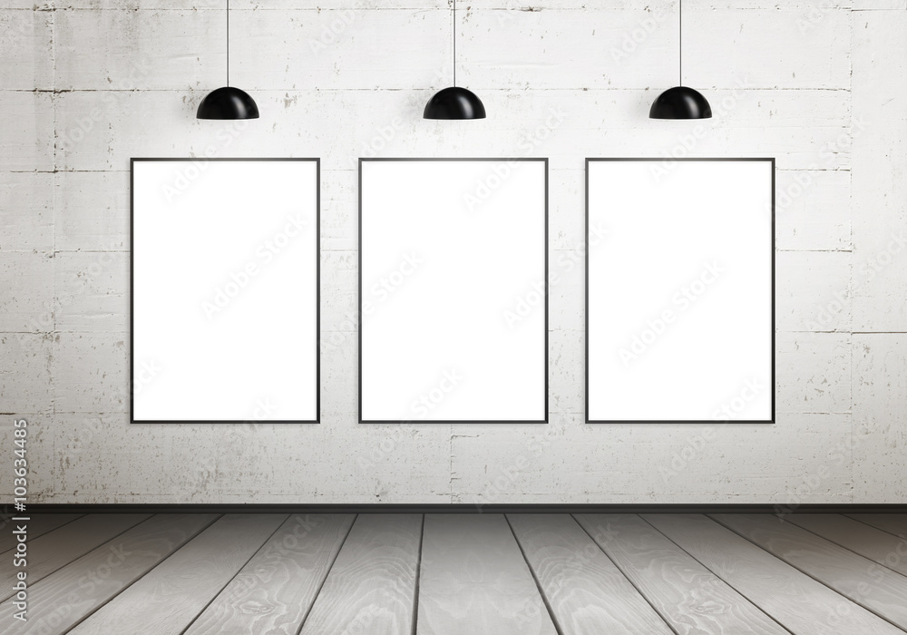 Poster frames isolated for mock up in gallery. Lamps illuminate the wall. Poster frames isolated for mock up in gallery. Lamps illuminate the wall.