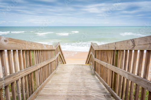 Wooden walkway to the beach © crazymonkstudio