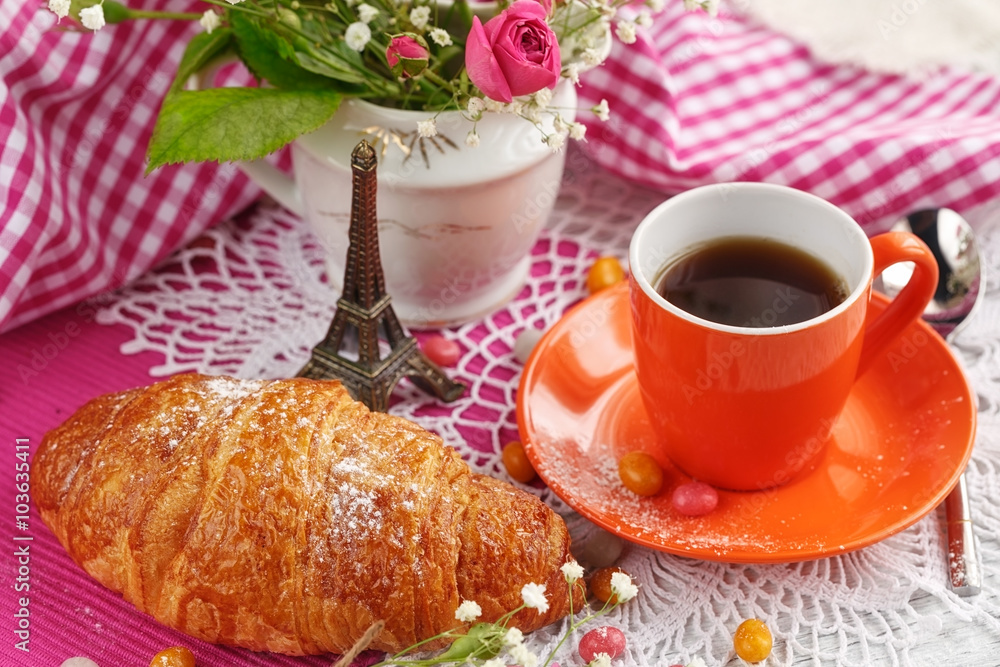 cup of coffee and croissant with the small Eiffel Tower cup of coffee and croissant with the small Eiffel Tower
