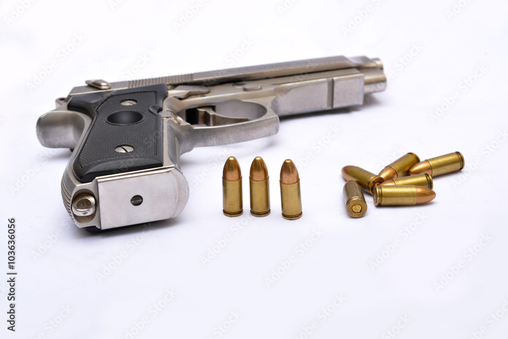 Automatic handgun pistol with magazine and bullets on white background