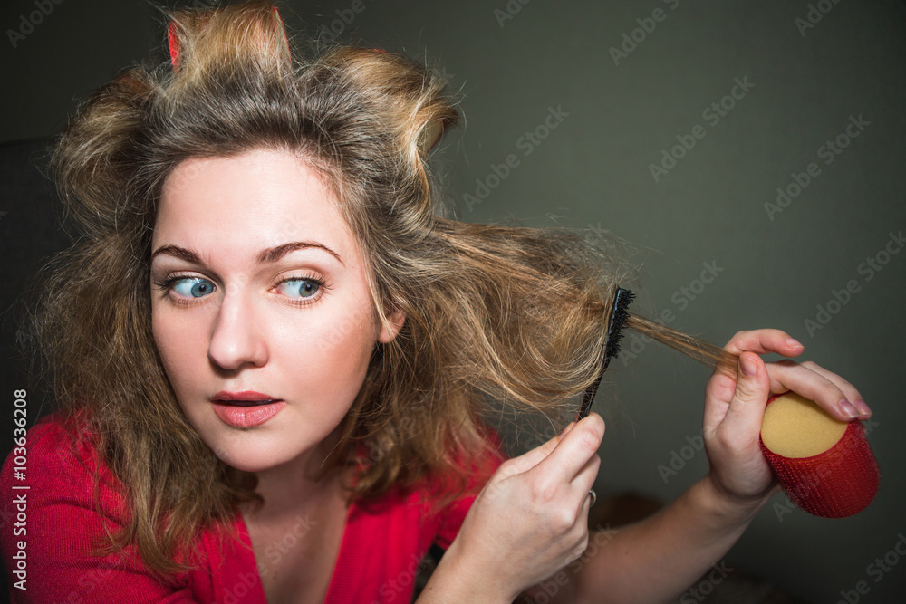 The girl in hair curlers. Surprise, perplexity, uncertainty, concern. Flash in the face