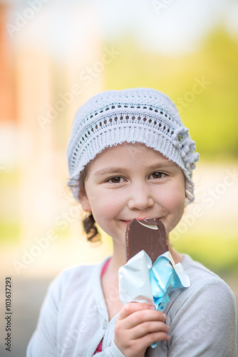 Cute girl eating ice-cream