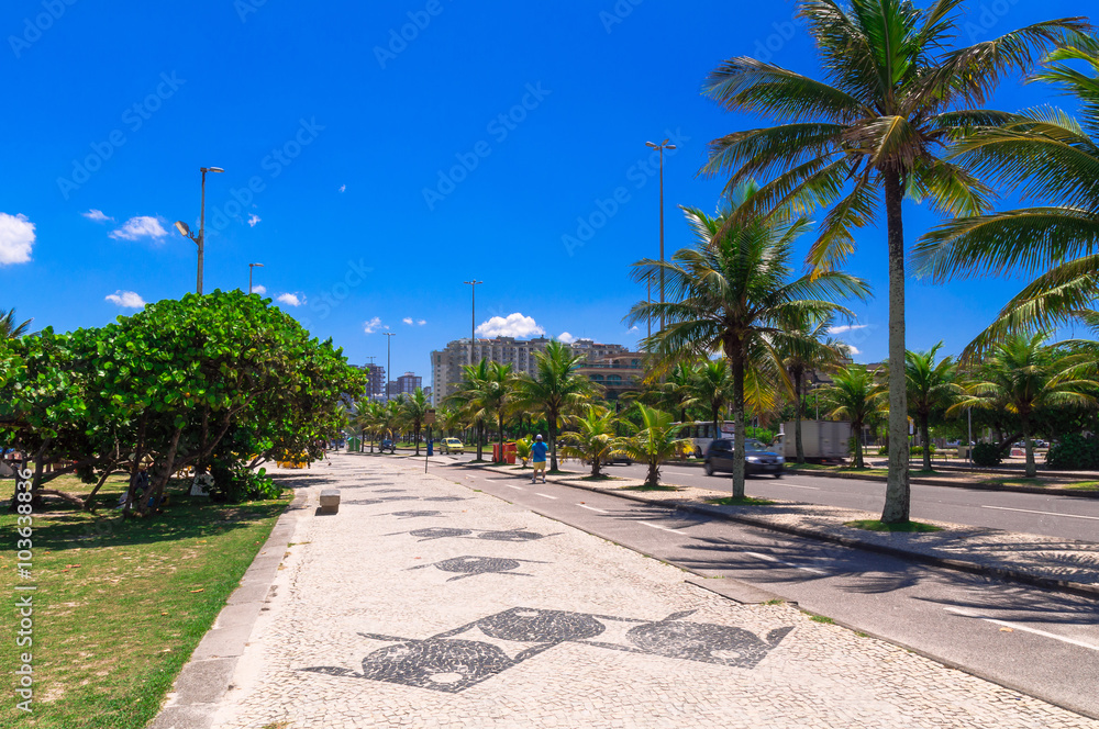 Barra da Tijuca beach with mosaic of sidewalk in Rio de Janeiro. Brazil Barra da Tijuca beach with mosaic of sidewalk in Rio de Janeiro. Brazil