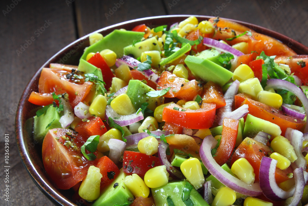 Salad with avocado, tomato, paprika, red onion and corn Salad with avocado, tomato, paprika, red onion and corn
