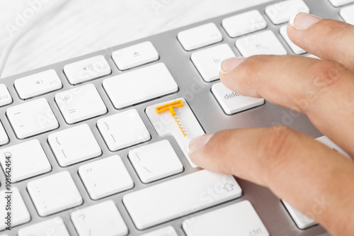 Woman pressing wine delivery button on computer keyboard