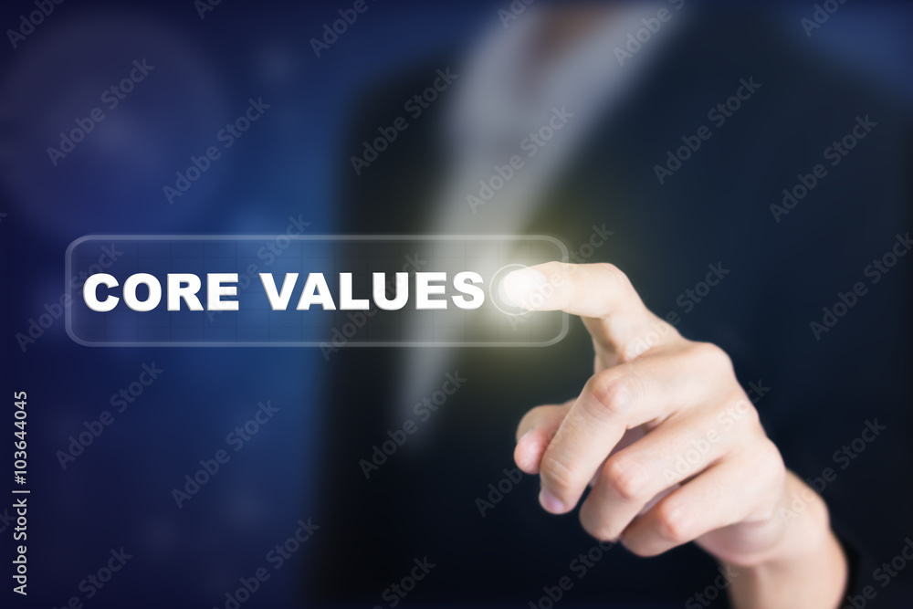Businessman pressing a CORE VALUES concept button. Can be used in advertising. Businessman pressing a CORE VALUES concept button. Can be used in advertising.