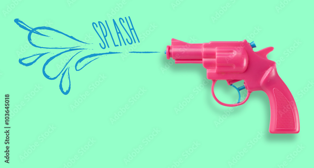 Pink water-gun on green background Pink water-gun on green background