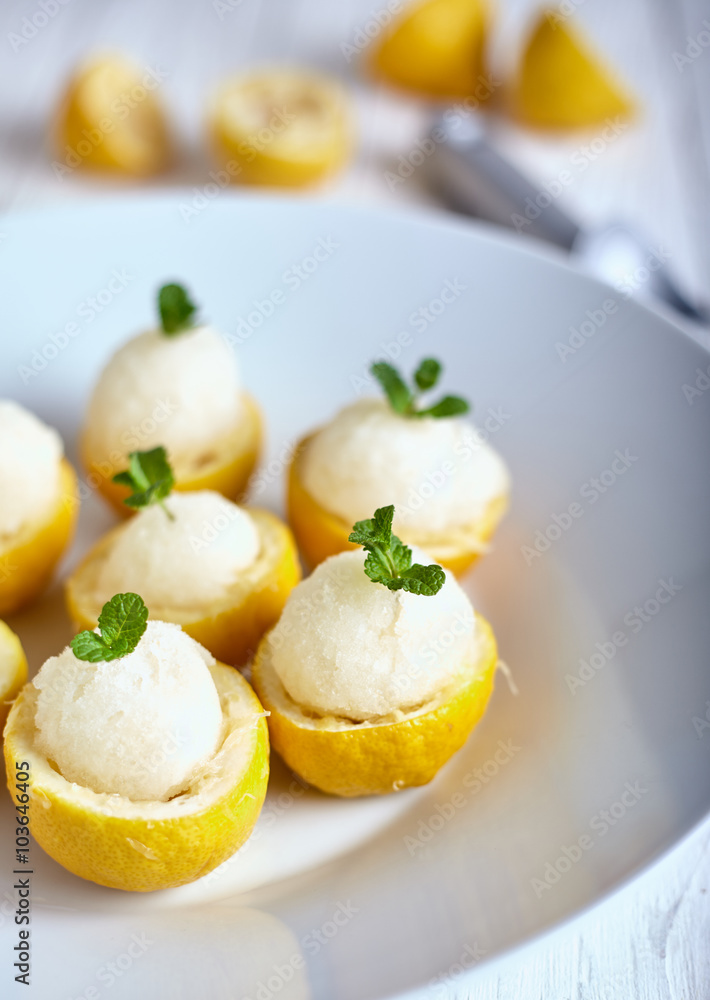 Lemon sorbet or ice cream inside fresh lemons Lemon sorbet or ice cream inside fresh lemons