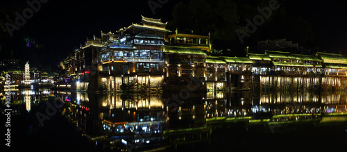 View of illuminated Wanming Pagoda in Fenghuang, photo