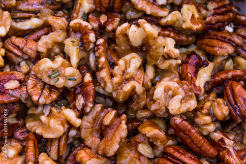 Mix nuts covered in butter garlic and rosemary mixture before ro
