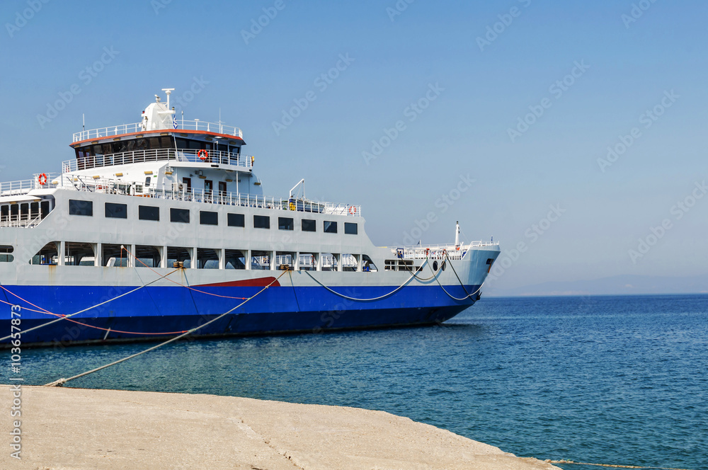 Blue ferryboat for the transport of people and cars