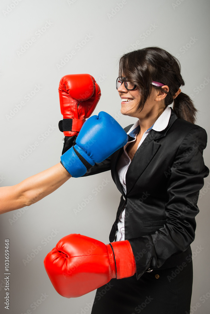 Business women with boxing gloves Business women with boxing gloves