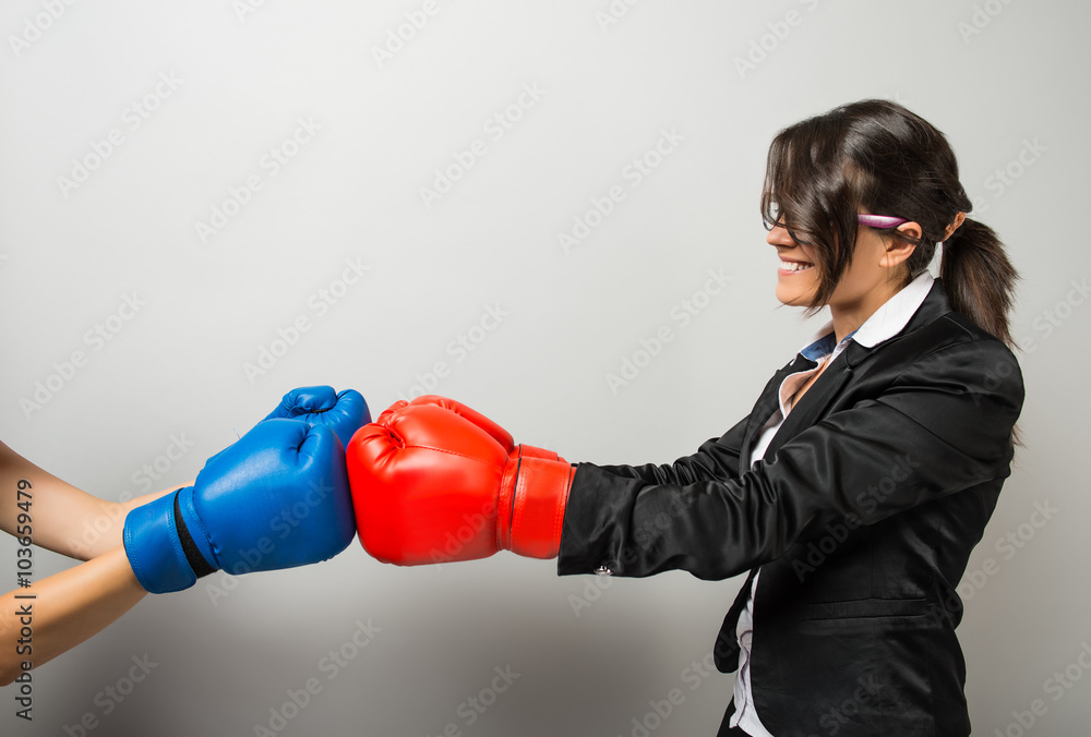 Business women with boxing gloves Business women with boxing gloves