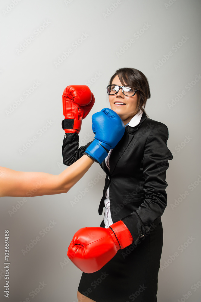 Business women with boxing gloves Business women with boxing gloves