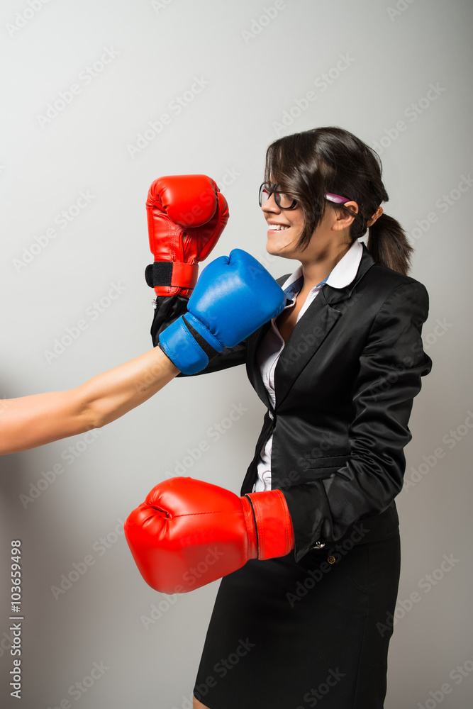 Business women with boxing gloves Business women with boxing gloves