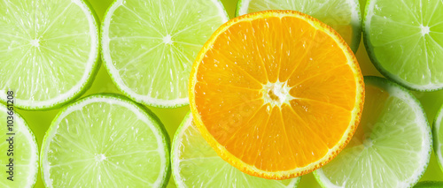 Citrus background with orange and lime slices, letterbox format
