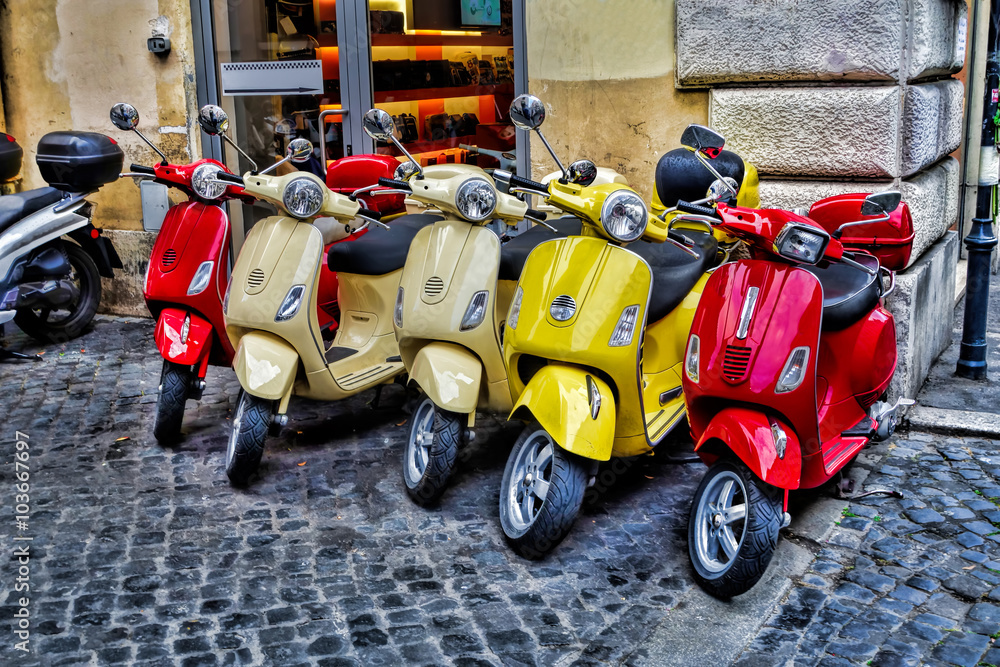 Fototapeta premium Scooters are parked on the city street in Rome, Italy