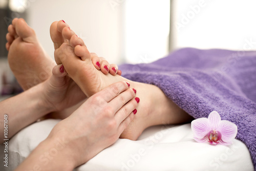 Woman having a pedicure treatment at a spa or beauty salon with