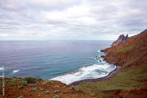 Rocky coastline with stone beach on the western part of La Gomera island near Arguamul village in Spain