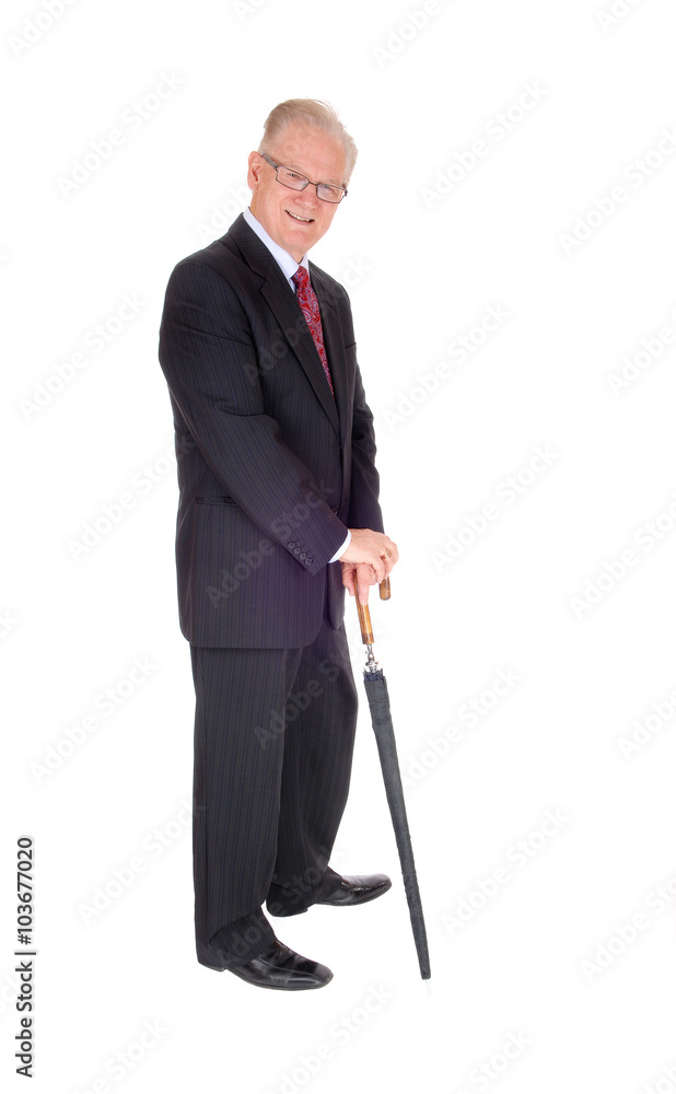 Senior man standing with umbrella. Senior man standing with umbrella.