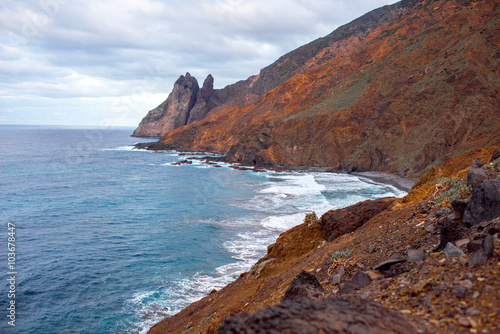 Rocky coastline with stone beach on the western part of La Gomera island near Arguamul village in Spain