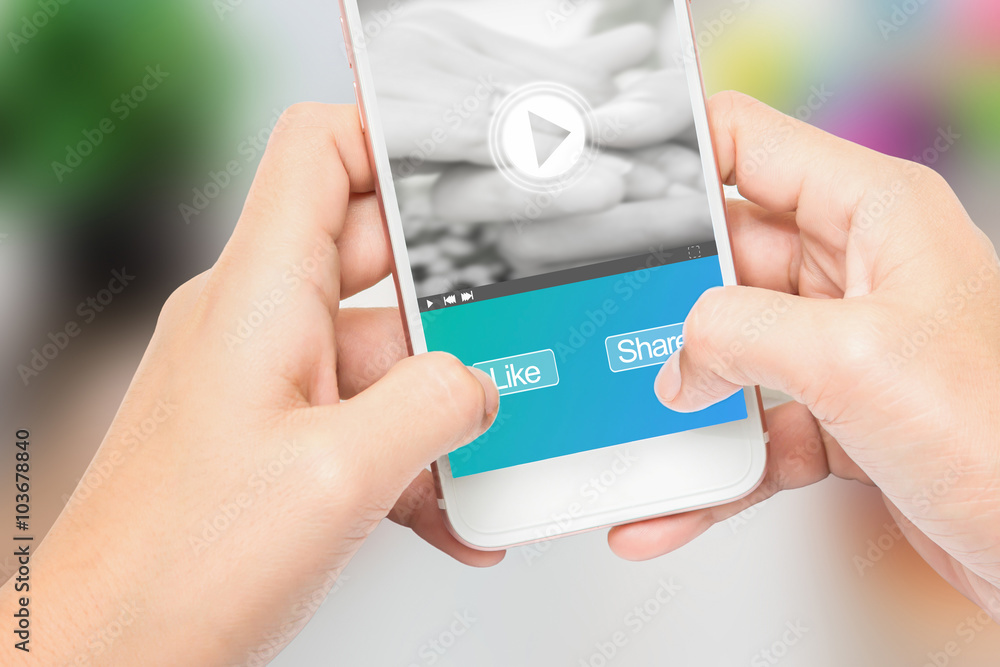 Hand holding the phone label like and share message, Can be used in advertising Hand holding the phone label like and share message, Can be used in advertising