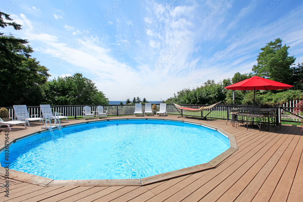 Large pool with chairs.