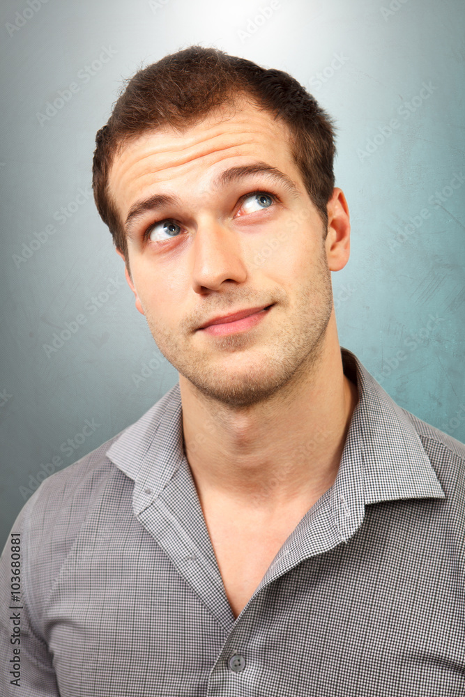 Fototapeta premium Pensive man thinking and looking up