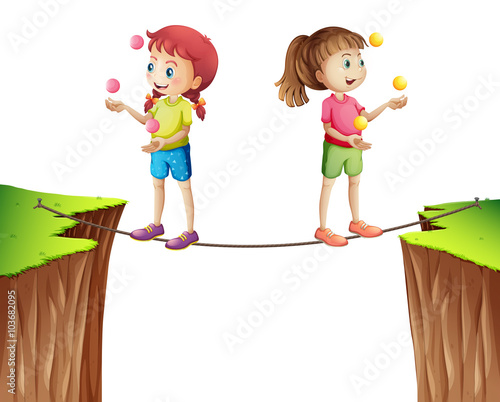 Two girls juggling balls on the rope