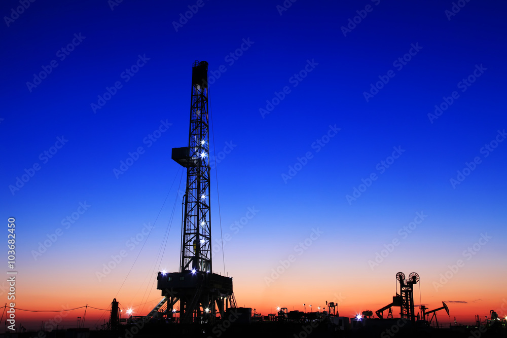 In the evening of oilfield derrick