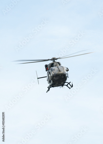 UH-72A Lakota flies over head with doors open