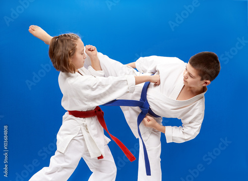 Young athletes train karate blows