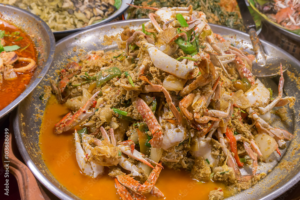 Fried crab in yellow curry, Stir-fried crab curry. Thailand night street food Fried crab in yellow curry, Stir-fried crab curry. Thailand night street food