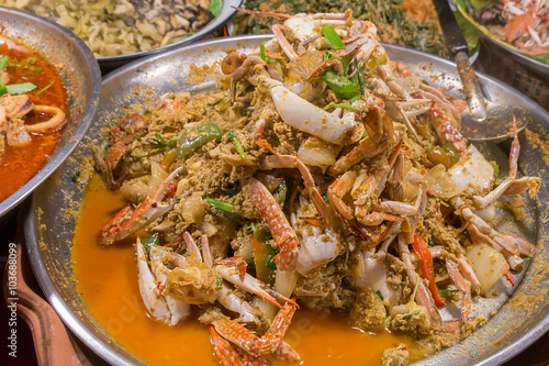 Fried crab in yellow curry, Stir-fried crab curry. Thailand night street food