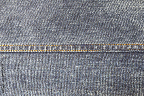 Texture of blue jeans textile close up