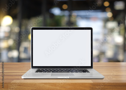 Blank screen laptop on table photo