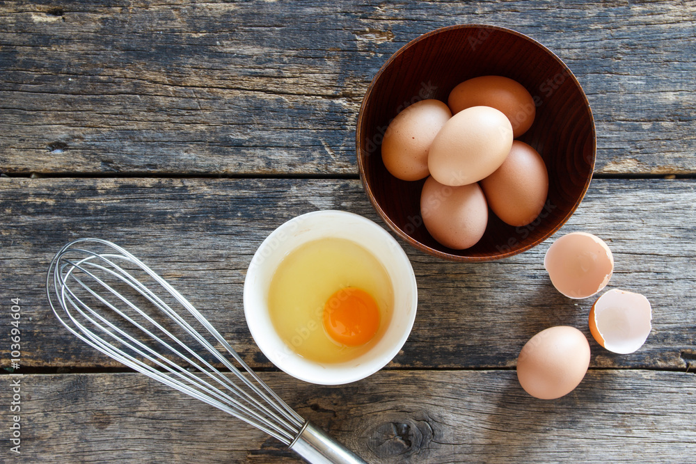 egeggs in a wooden bowl on the table top view egeggs in a wooden bowl on the table top view