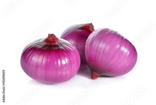 peeled whole red onion, shallots on white background