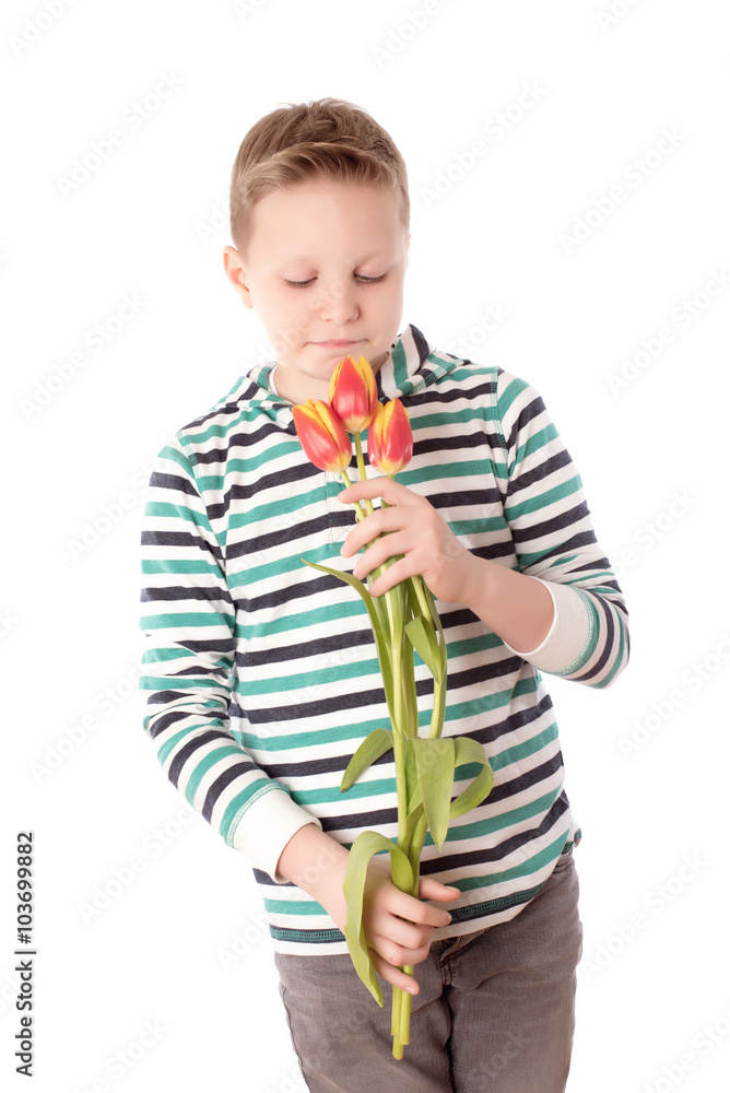 Young boy with tulips isolated on white background Young boy with tulips isolated on white background