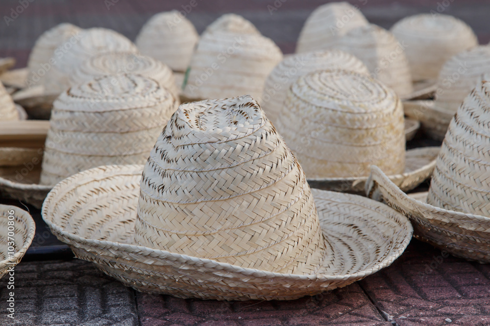 Handmade Panama Hats are stacked for sale at the outdoor craft market