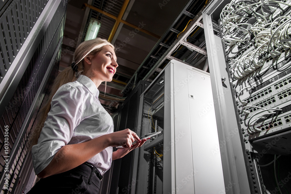 Young engineer businesswoman in server room Young engineer businesswoman in server room