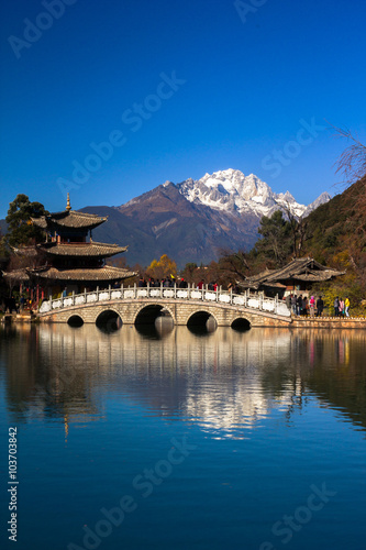 Black Dragon Pool. It's a famous pond in the scenic Jade Spring Park (Yu Quan Park) located at the foot of Elephant Hill, a short walk north of the Old Town of Lijiang in Yunnan province, China.