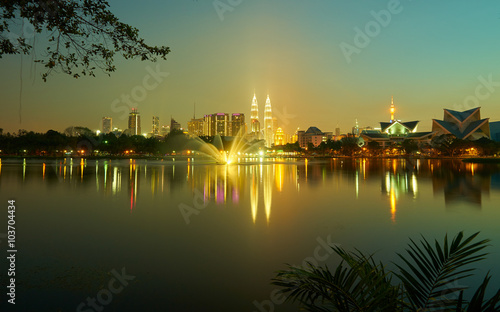 Night view of Kuala Lumpur city with stunning reflection in water