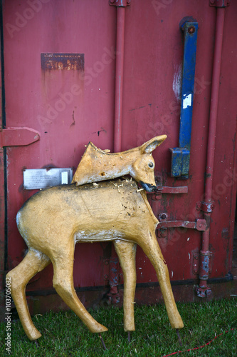 Broken sculpture of a deer photo